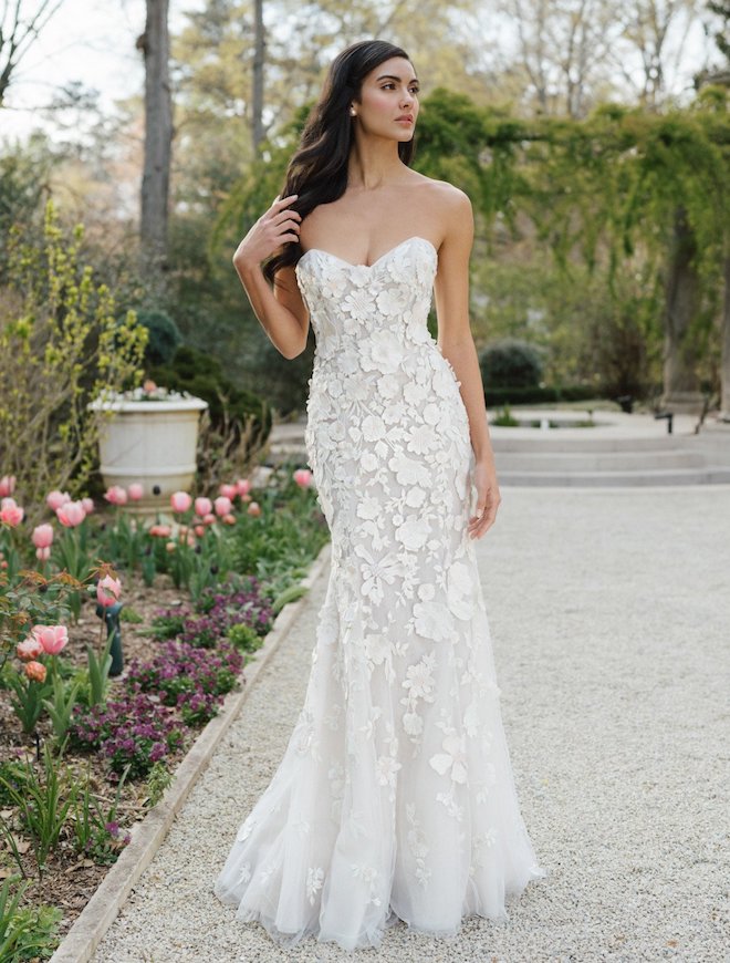 An Anne Barge gown with floral appliques. 