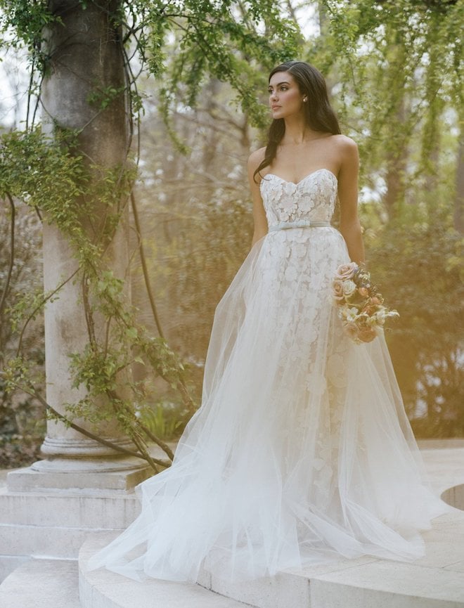 The habersham gown by Anne Barge with a tulle overskirt and velvet waistband.