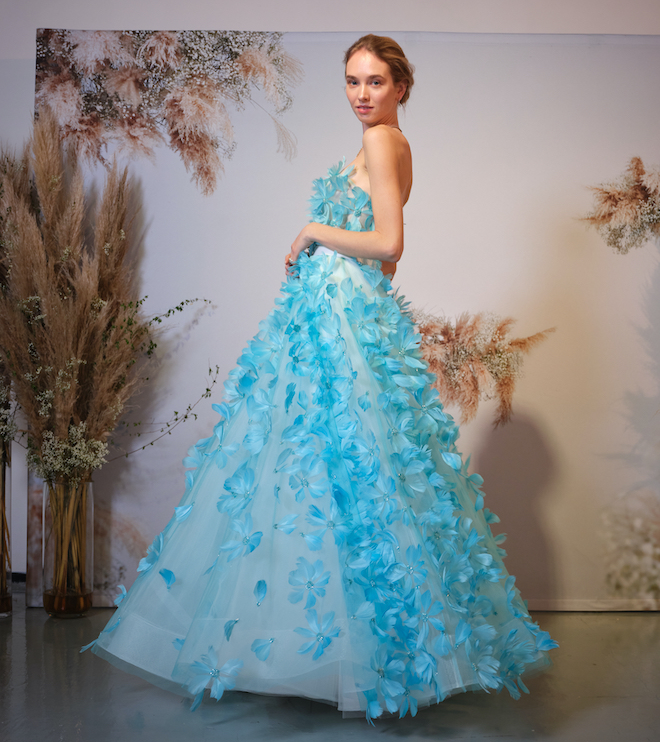 A bright blue wedding gown with floral appliques.