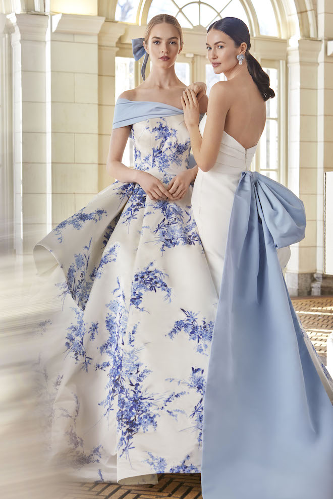 Two brides wearing wedding gowns with pops of blue by Sareh Nouri. 