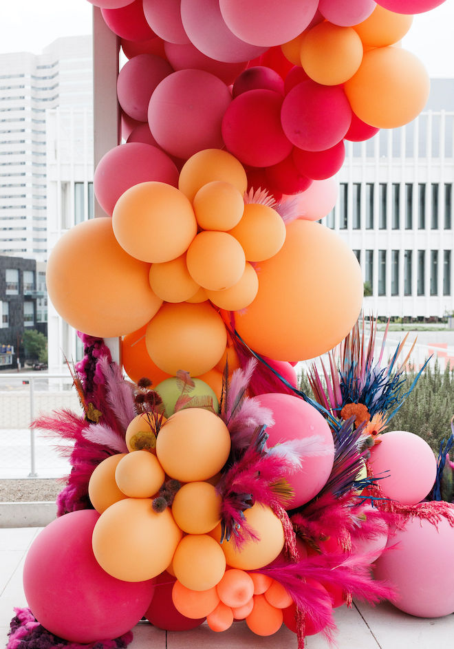 A pink and orange balloon arrangement.