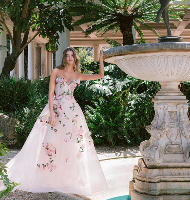 A model wearing the english rose gown by Monique Lhuillier