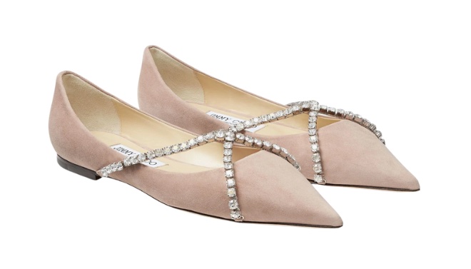 Blush leather ballet flats with crystal embellishments.