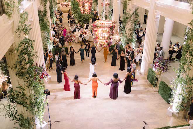 Sorority sisters gather around a bride during a Houston wedding reception at Corinthian Houston 