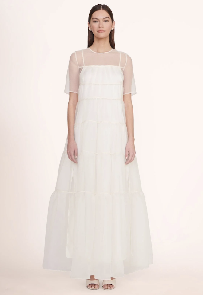 A sheer white tiered gown. 