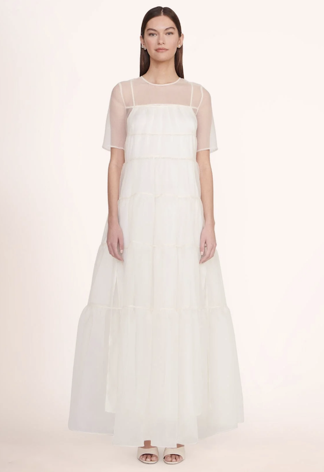 A sheer white tiered gown.