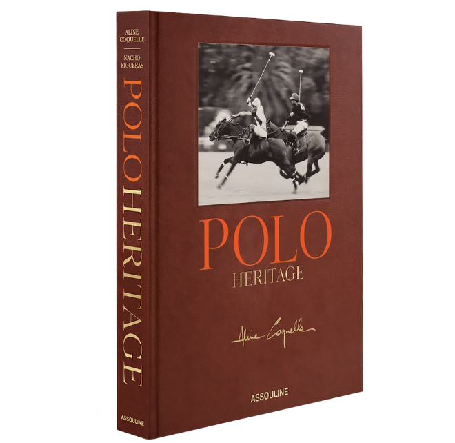 A maroon book with the title "Polo Heritage" with a black and white photo of two Polo players on horses.