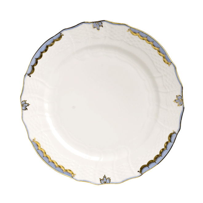 A white Herend salad plate with blue and gold designs on the edge of the plate, available at Bering's Houston, Texas. 