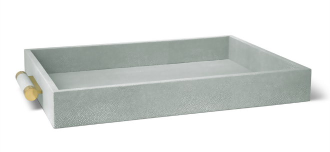 A textured sage green serving tray with gold handles.