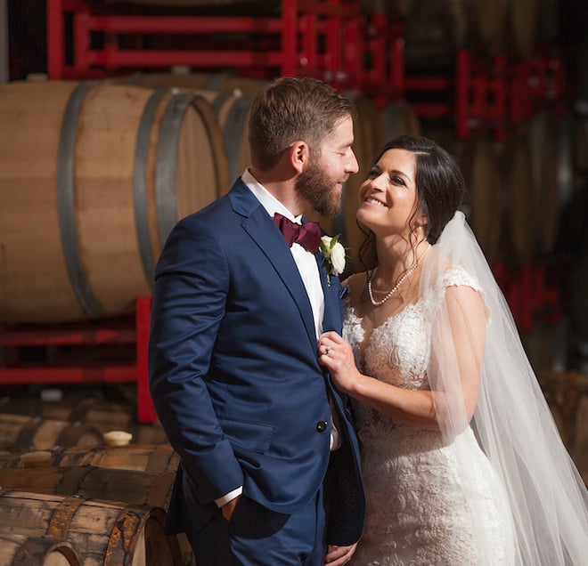 Bride and groom smiling at Saint Arnold Brewing Company 