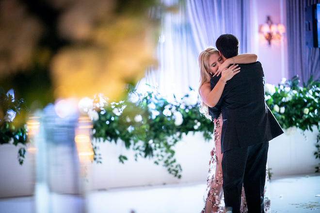 The bride and groom hugging during a private last dance. 