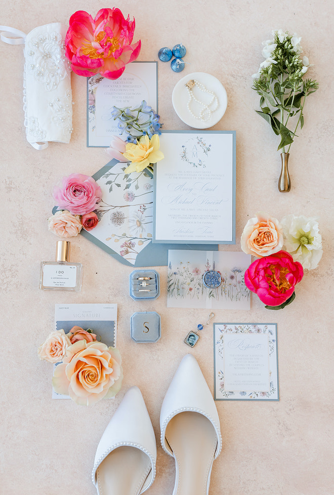 Amy Maddox Photography captures a flat lay of the light blue wedding stationery and invitations. 