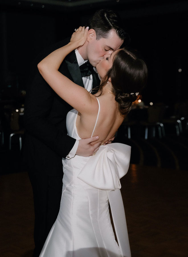 The bride and groom kissing during a private last dance. 