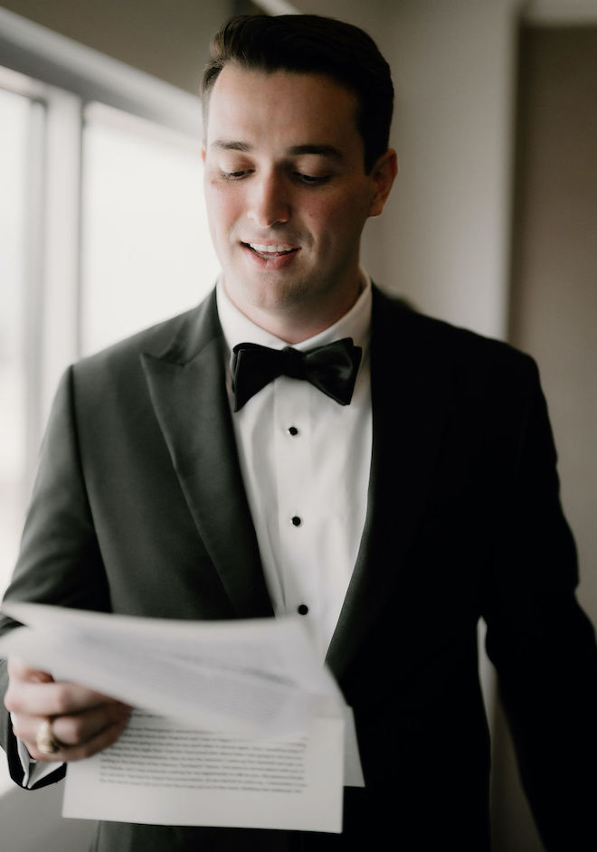 The groom privately reading a letter to the bride. 