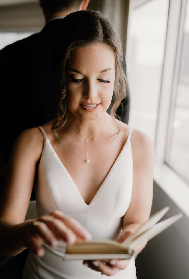 The bride crying while reading her vows privately to the groom. 