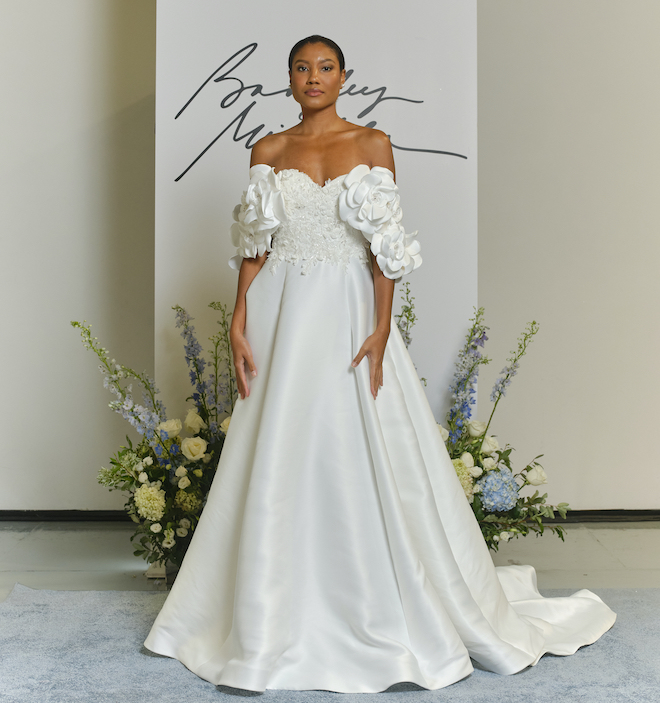 A Badgley Mischka gown with floral sleeves. 