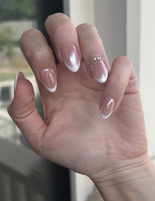 This wedding manicure from Milano Nail Spa The Heights is a chrome French tip with rhinestones. 