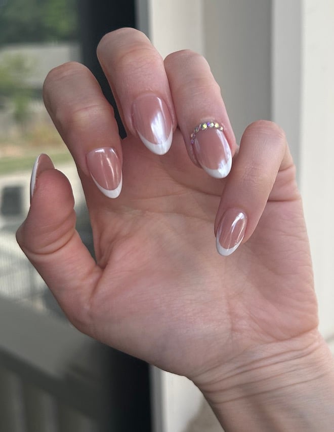 This wedding manicure from Milano Nail Spa The Heights is a chrome French tip with rhinestones. 