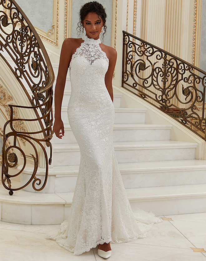A lace halterneck wedding gown by Morilee. 