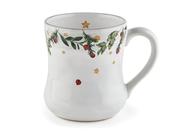 White mug with misteltoe, stars and cranberry design at the top. 