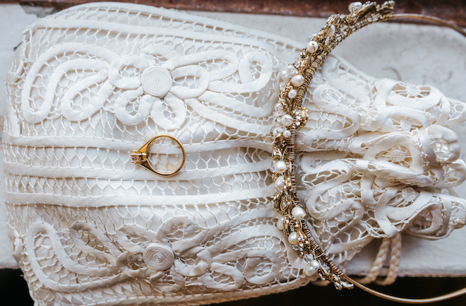 A flat lay of the brides gold accessories for her bohemian wedding day.