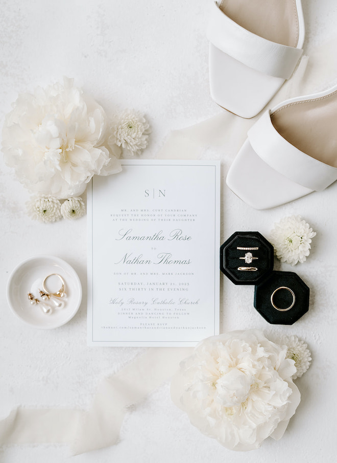 Erika Geier Photography captures a flat lay of black and white wedding stationery. 