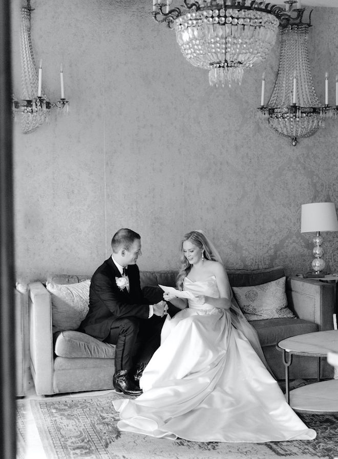 The bride reading a letter to the groom. 