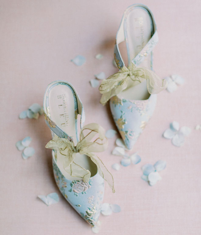 The bride's blue heels with a pink floral print. 