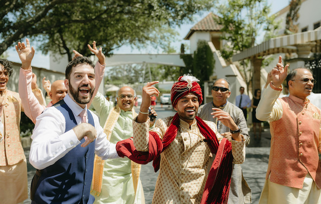 The groom and his friends and family celebrate in a lively baraat, before his traditional Hindu ceremony at the Bell Tower on 34th. 
