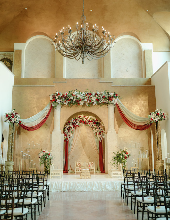 Red, white and blush decor and florals detail the Hindu ceremony at the wedding venue, Bell Tower on 34th. 
