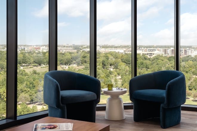 At the wedding venue, Thompson Houston, panoramic windows in the hotel suite overlook the Buffalo Bayou Park.