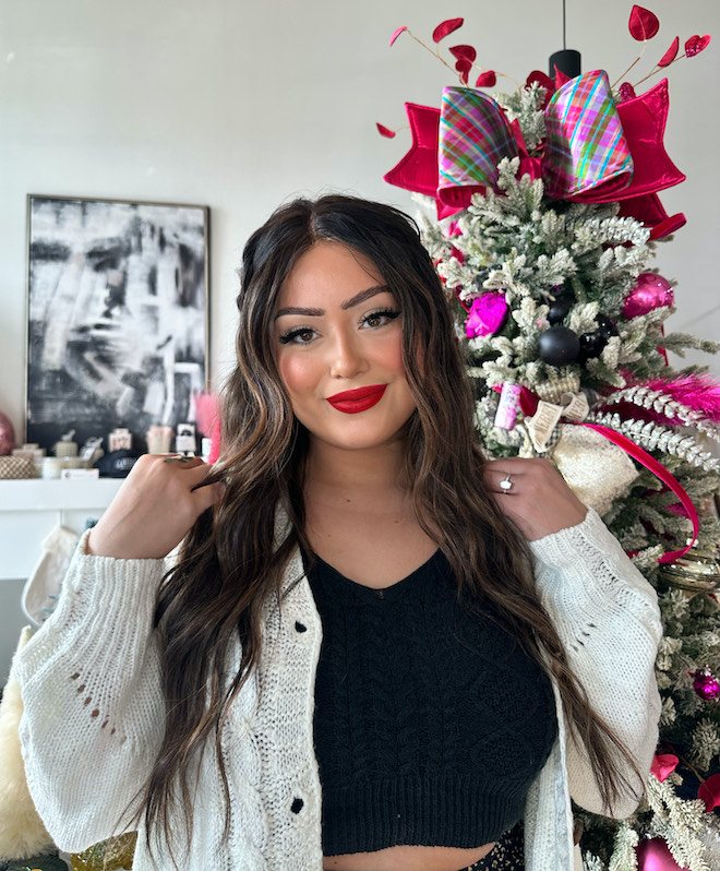For a glam holiday looks the model wears her hair in soft waves and red lipstick.