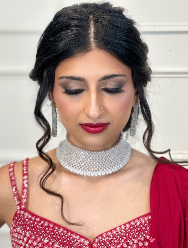 The bride wears a smokey eye and red lipstick for a glam look for the Holidays.