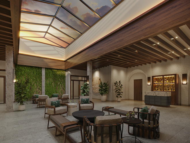 A seating area at the Plaza San Antonio Hotel & Spa with a glass ceiling. 