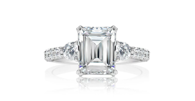 An emerald diamond sidestones engagement ring available at Zadok Jeweler's Bridal Shop.