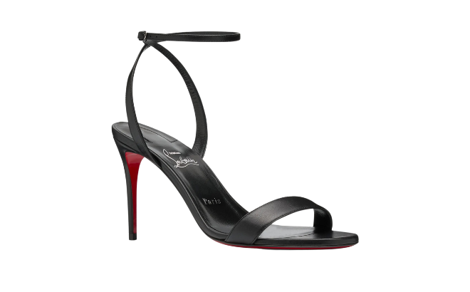 Black leather Louboutin sandals with a red sole bottom. 