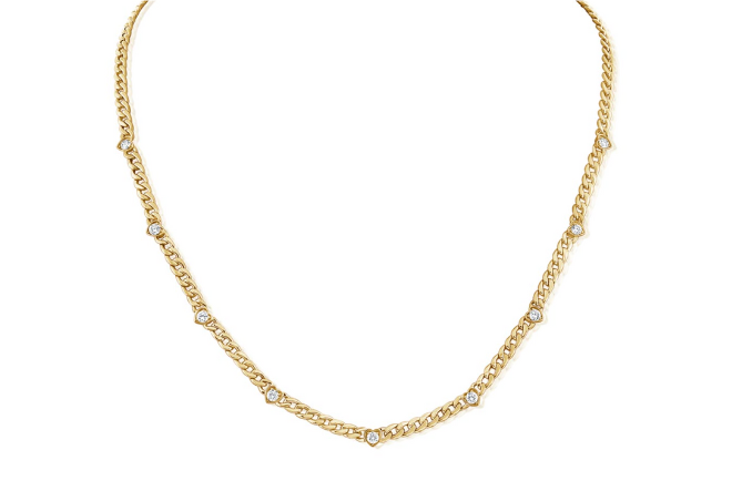 Gold necklace with heart shaped diamonds. 