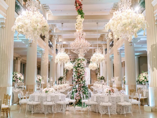 The Corinthian Houston decorated in neutral hues and large floral arrangements. 