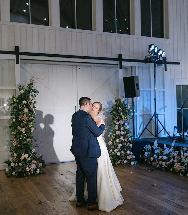 The bride and groom sharing a private last dance in the reception space. 