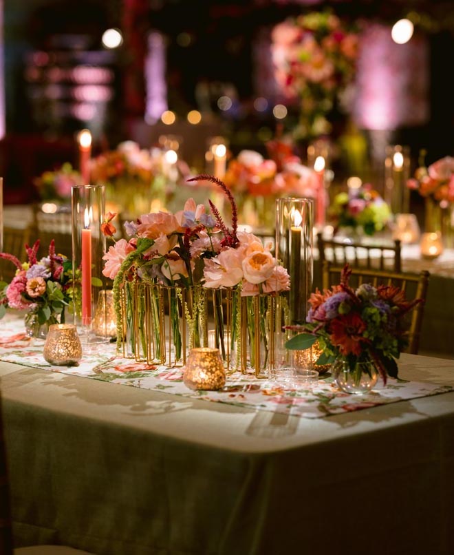 Delicate florals and candelight on the reception tables. 