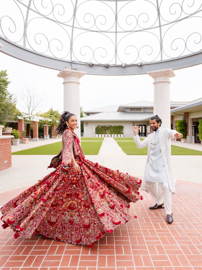 The bride and groom dance outside their sangeet venue in California. 
