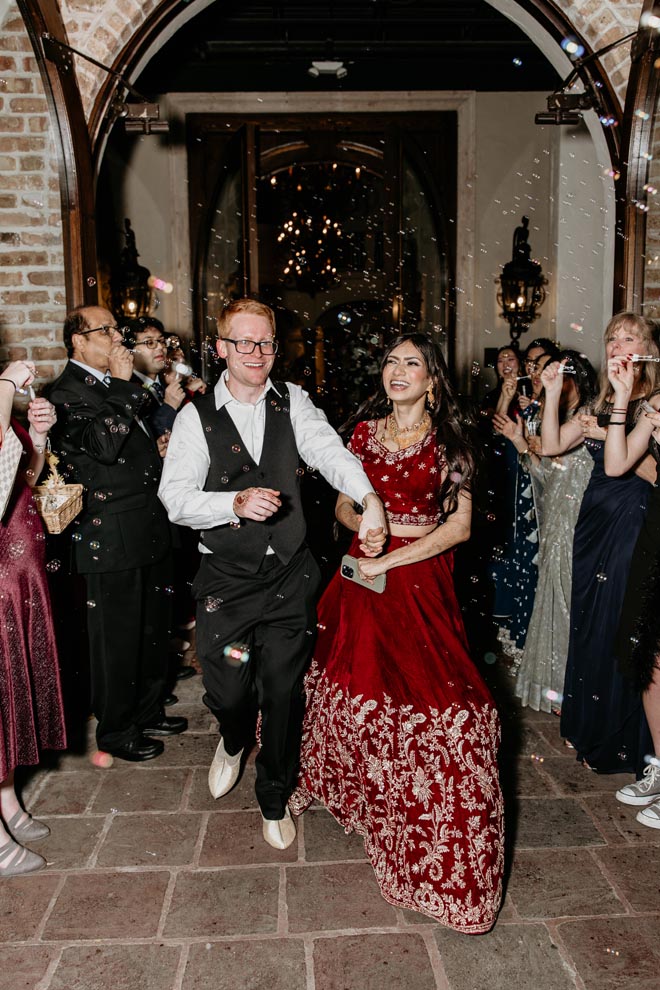 The bride and groom exit their wedding reception at The Bell Tower on 34th with a bubble send-off. 