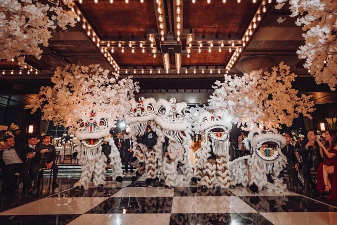 The couple honor their cultural roots by incorporating a lion dance at their wedding reception in Houston.