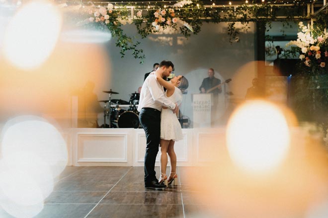 The bride and groom share a private last dance at their ballroom wedding at their Houston wedding venue.