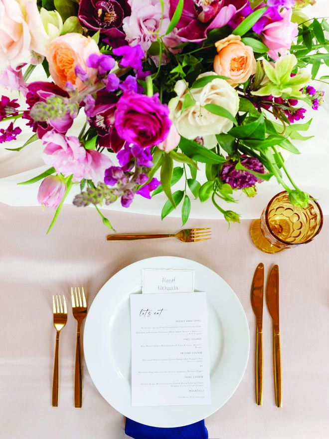 Purple, peach and white florals decorate the tablescapes at the couple's Nikkah venue. 