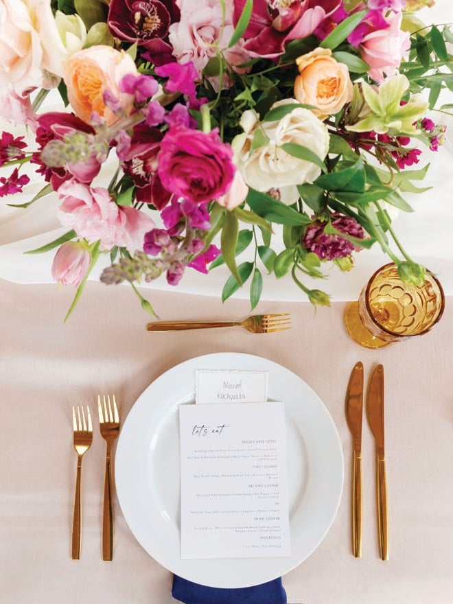 Purple, peach and white florals decorate the tablescapes at the couple's Nikkah venue. 