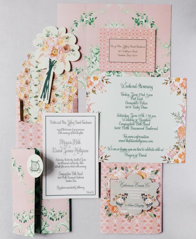 A floral print green, pink and orange wedding invitation suite.