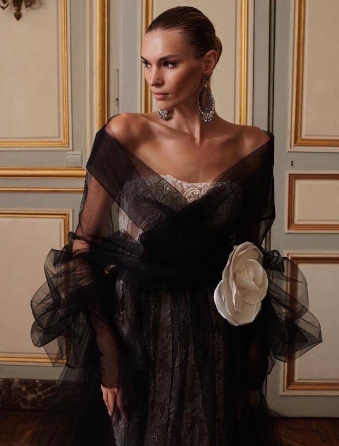 Galia Lahav designs a black tulle luxury wedding gown. 