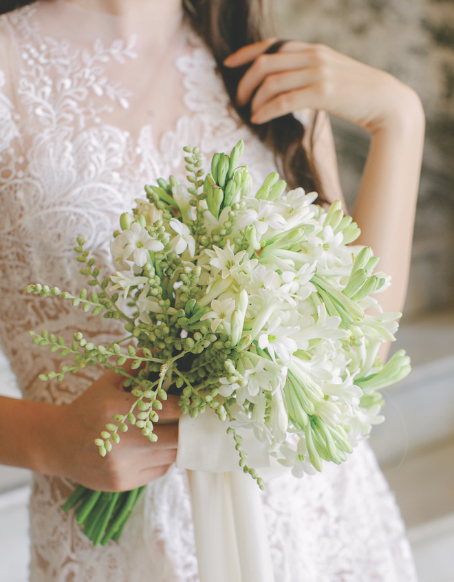 A bouquet with greenery and white florals. 