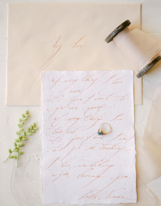 A letter written on white and beige stationery. 